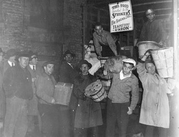 Seafarers carrying donated food